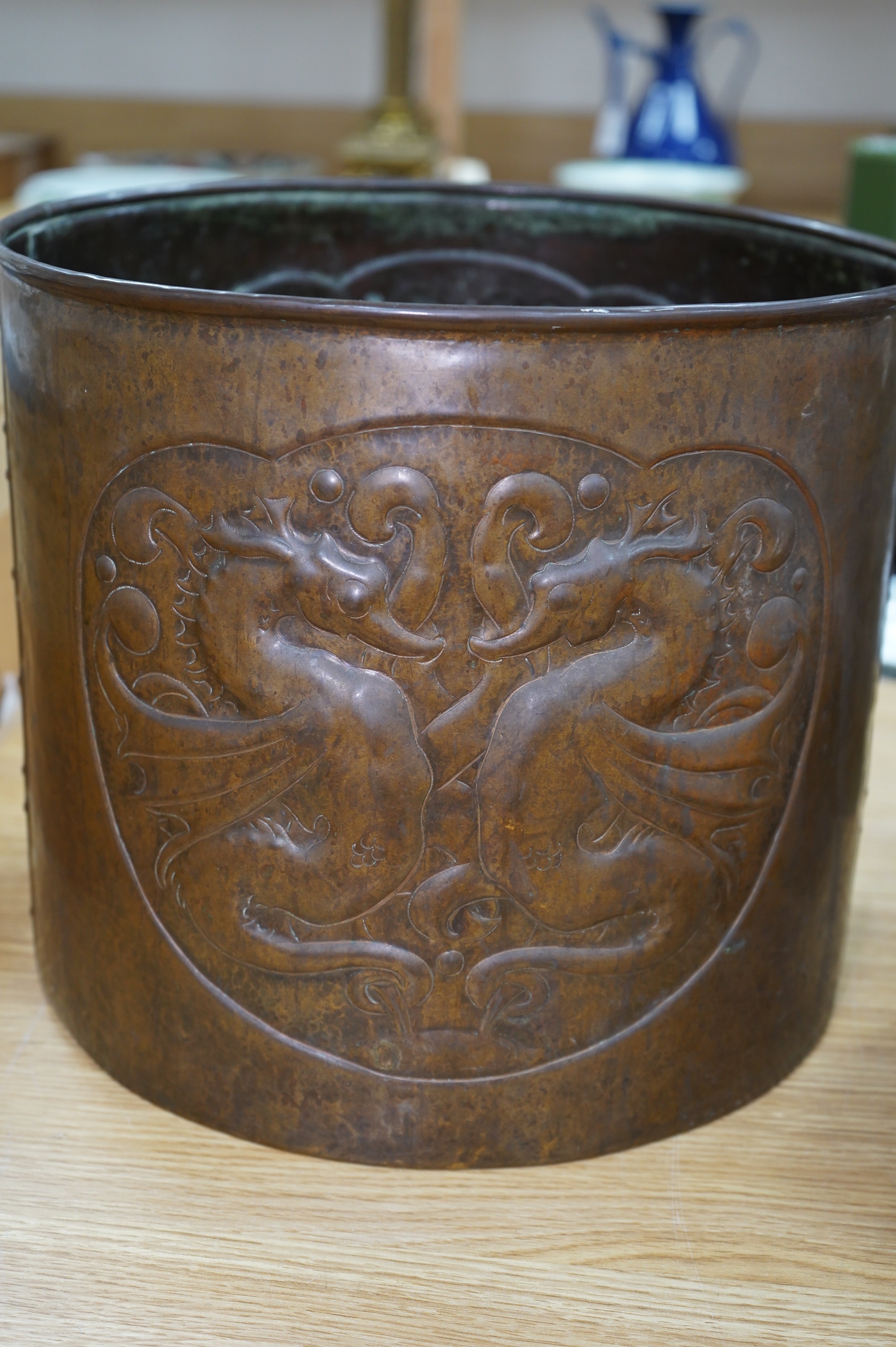 A large Arts and Crafts embossed copper jardiniere decorated with seahorses, stamped Newlyn to base, 28cm high, 33cm in diameter. Condition - good